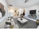 Stylish living room with modern furniture, cozy textures and plenty of room for entertaining at 5 Misty Grove Trl, Franklinton, NC 27525