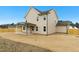 View of the home's backyard with a covered patio, a large space for outdoor activities, and a fence for privacy at 51 Blackberry Ln, Benson, NC 27504