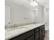 Elegant bathroom with a double sink vanity, granite countertop, modern fixtures, and a large mirror at 51 Blackberry Ln, Benson, NC 27504
