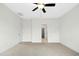 Bedroom with neutral carpet, ceiling fan, closet, and adjacent doorway at 51 Blackberry Ln, Benson, NC 27504