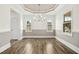Bright dining room with stylish chandelier, elegant wainscoting, and hardwood floors, perfect for gatherings at 51 Blackberry Ln, Benson, NC 27504