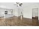 Open concept living area with wood-look floors and a view into the kitchen at 51 Blackberry Ln, Benson, NC 27504