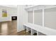 Mudroom with built-in storage bench and hooks, adjacent to the living room at 51 Blackberry Ln, Benson, NC 27504