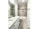 Modern bathroom featuring double sink vanity with granite countertops and a tub-shower combo with tiled walls at 515 Sanctuary Trl, Cameron, NC 28326
