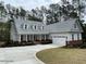 Desirable craftsman-style home with a manicured lawn, brick base, a welcoming porch, and an attached two car garage at 515 Sanctuary Trl, Cameron, NC 28326
