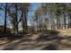 Large, wooded backyard with mature trees and a natural landscape offers privacy and space at 5845 Farmwell Road Rd, Raleigh, NC 27610