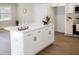 Spacious kitchen featuring a large island with seating and modern cabinetry at 5845 Farmwell Road Rd, Raleigh, NC 27610