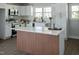 Modern kitchen with stainless steel appliances and a marble-topped island at 5845 Farmwell Road Rd, Raleigh, NC 27610