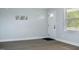 Light-filled living room featuring vinyl plank flooring and fresh paint at 5845 Farmwell Road Rd, Raleigh, NC 27610