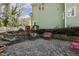 An outdoor patio featuring a rock garden, a privacy fence, and comfortable seating area at 6108 King Croydon Ct, Raleigh, NC 27603
