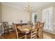 Formal dining room featuring a large wooden table and a chandelier at 6108 King Croydon Ct, Raleigh, NC 27603