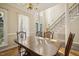 Spacious dining room showcasing hardwood floors and lots of natural light at 6108 King Croydon Ct, Raleigh, NC 27603