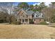 Beautiful brick home showcasing architectural details and inviting curb appeal at 6108 King Croydon Ct, Raleigh, NC 27603