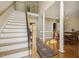 Inviting foyer with staircase, soaring ceilings, and elegant dining area at 6108 King Croydon Ct, Raleigh, NC 27603