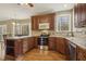 Well-designed kitchen area featuring rich cabinetry, stainless steel appliances, and an adjacent breakfast nook at 6108 King Croydon Ct, Raleigh, NC 27603