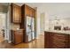 Open-concept kitchen with stainless steel appliances, wood cabinets, and granite countertops at 6108 King Croydon Ct, Raleigh, NC 27603