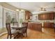 Charming eat-in kitchen with wooden cabinets and a lovely breakfast nook at 6108 King Croydon Ct, Raleigh, NC 27603