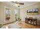 Sitting room showcasing hardwood floors, natural light, and a comfortable seating area at 6108 King Croydon Ct, Raleigh, NC 27603