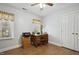 Home office with hardwood floors, a wooden desk, and natural light from the window at 6108 King Croydon Ct, Raleigh, NC 27603
