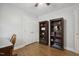 Office space features hardwood floors, built-in bookshelves, and natural light from a nearby window at 6108 King Croydon Ct, Raleigh, NC 27603