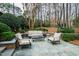 Outdoor lounge seating on bluestone patio perfect for relaxing in the landscaped yard at 620 Marlowe Rd, Raleigh, NC 27609