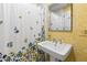 Bathroom featuring floral wallpaper, a pedestal sink, and a shower with a curtain at 620 Marlowe Rd, Raleigh, NC 27609