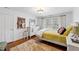 Bedroom with a large bed and a white dresser situated on top of hardwood floors at 620 Marlowe Rd, Raleigh, NC 27609