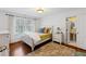 Bedroom features hardwood floors, a bed, and a window with natural light at 620 Marlowe Rd, Raleigh, NC 27609