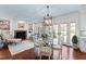 Cozy breakfast nook with a glass table, fireplace, and access to the patio and kitchen at 620 Marlowe Rd, Raleigh, NC 27609