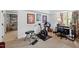 Exercise room including stationary bike, exercise bench, and adjacent storage at 620 Marlowe Rd, Raleigh, NC 27609