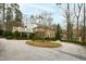 Stately brick home features a circular driveway and manicured landscaping at 620 Marlowe Rd, Raleigh, NC 27609