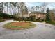 Traditional brick home with circle drive and landscaped yard at 620 Marlowe Rd, Raleigh, NC 27609
