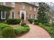 Beautiful brick home has a brick walkway and meticulously manicured landscaping at 620 Marlowe Rd, Raleigh, NC 27609
