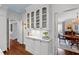 Bright kitchen featuring a white cabinet with glass doors to display dishware, books, and decor at 620 Marlowe Rd, Raleigh, NC 27609