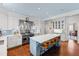 Chef's kitchen with island, stainless steel appliances, and custom cabinetry at 620 Marlowe Rd, Raleigh, NC 27609