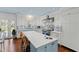 Bright kitchen features a large island, modern appliances, and ample counter space at 620 Marlowe Rd, Raleigh, NC 27609