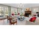 Bright living room with fireplace, large windows and stylish furniture at 620 Marlowe Rd, Raleigh, NC 27609