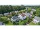 Beautiful aerial view of a neighborhood with mature trees and well-maintained homes and green lawns at 6306 Winding Arch Dr, Durham, NC 27713