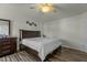 Bedroom featuring dark wood furniture, a dresser and a queen bed at 6306 Winding Arch Dr, Durham, NC 27713