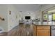 Open-concept living room with modern furnishings, hardwood floors, and natural light at 6306 Winding Arch Dr, Durham, NC 27713