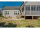 View of backyard featuring a patio, screened-in porch, and landscaping of the home at 65 Walking Trl, Youngsville, NC 27596