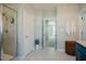 Bathroom featuring a glass shower and adjacent vanity at 65 Walking Trl, Youngsville, NC 27596