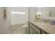 Bright bathroom with stone countertop and a shower-tub combo at 65 Walking Trl, Youngsville, NC 27596