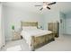A cozy bedroom featuring a wooden bed frame and ceiling fan at 65 Walking Trl, Youngsville, NC 27596