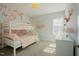 Bedroom featuring floral wallpaper, bunk beds and neutral paint at 65 Walking Trl, Youngsville, NC 27596