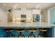Spacious kitchen island featuring barstool seating and stainless appliances at 65 Walking Trl, Youngsville, NC 27596