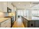 Modern kitchen with stainless steel appliances and granite countertops at 65 Walking Trl, Youngsville, NC 27596