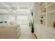 Bright living room with coffered ceiling, fireplace, built-ins and backyard views at 65 Walking Trl, Youngsville, NC 27596