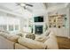 Cozy living room featuring a fireplace, built-in shelving, and a comfortable sectional sofa at 65 Walking Trl, Youngsville, NC 27596