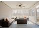 Relaxing screened porch with comfortable seating and a cozy fire pit table at 65 Walking Trl, Youngsville, NC 27596